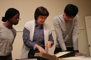 Marcelle Doheny teaching History 100 class using rare books in Special Collections